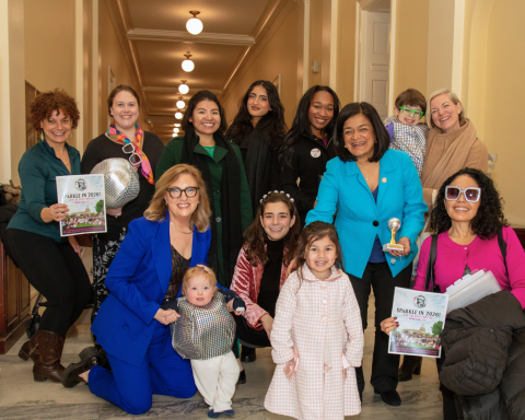 MomsRising members and staff with Rep. Pramila Jayapal at Mombassador storybook delivery event