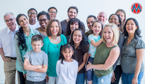 A group of diverse people of different ages smiling