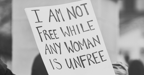 A protest poster that says 'I am not free while any woman is unfree'