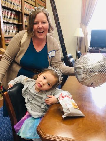 MomsRising member Jean with her daughter at our Mombassador disco-themed event