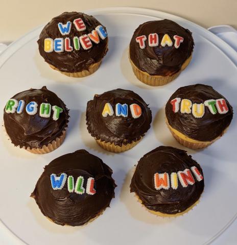 [IMAGE DESCRIPTION: A photo of cupcakes with chocolate frosting and candy letters on top that read "We believe that right and truth will win!"]