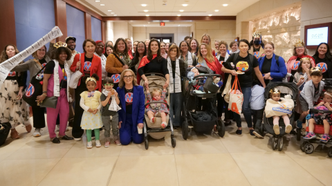 Moms Pay the Price Event — Bringing the Receipts to Congress Large group of moms and kids at holding oversized "receipts" to protest affordability crisis