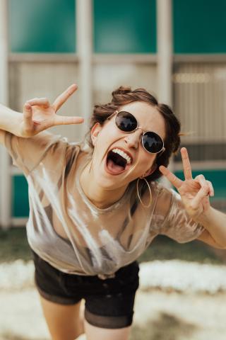 woman giving peace signs