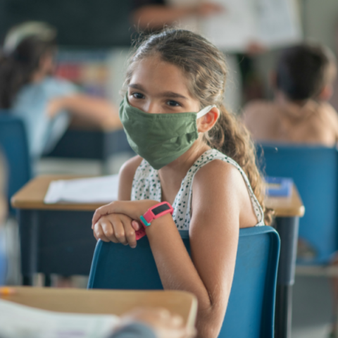 Girl wearing mask in class