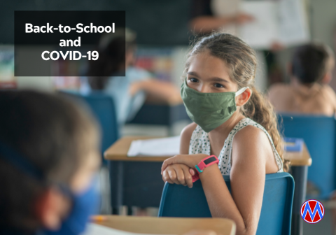 Girl wearing mask in class