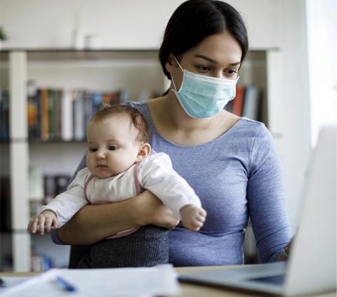 Masked woman and baby