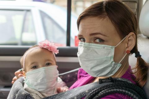 mom and baby wearing medical mask