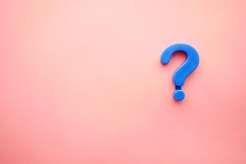 pink background with blue question mark
