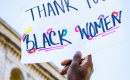 black woman holding up sign thanking Black women