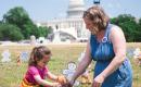 MOMbassador Jean with her daughter at the "Fund Care, Not ICE" DC event