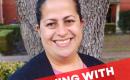 Martha Mouret-Sanders, Dallas ISD teacher. Woman smiling at camera with a tree behind her. 
