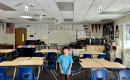 A little boy in a new classroom