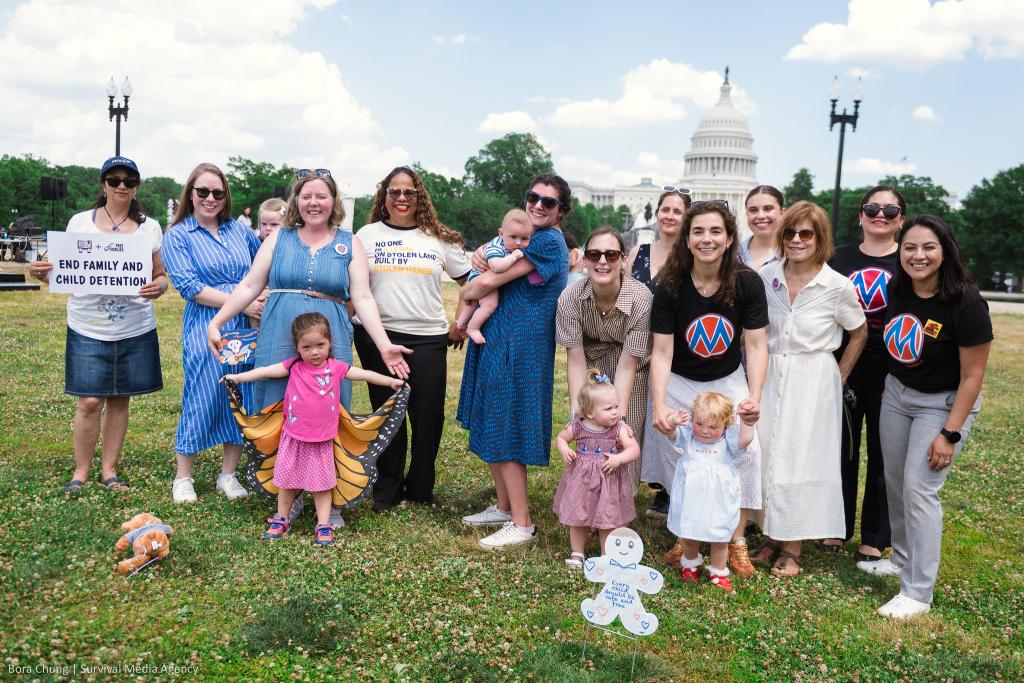 17 MomsRising staff, members, and children as well as other advocates at the "Fund Care, Not ICE" event