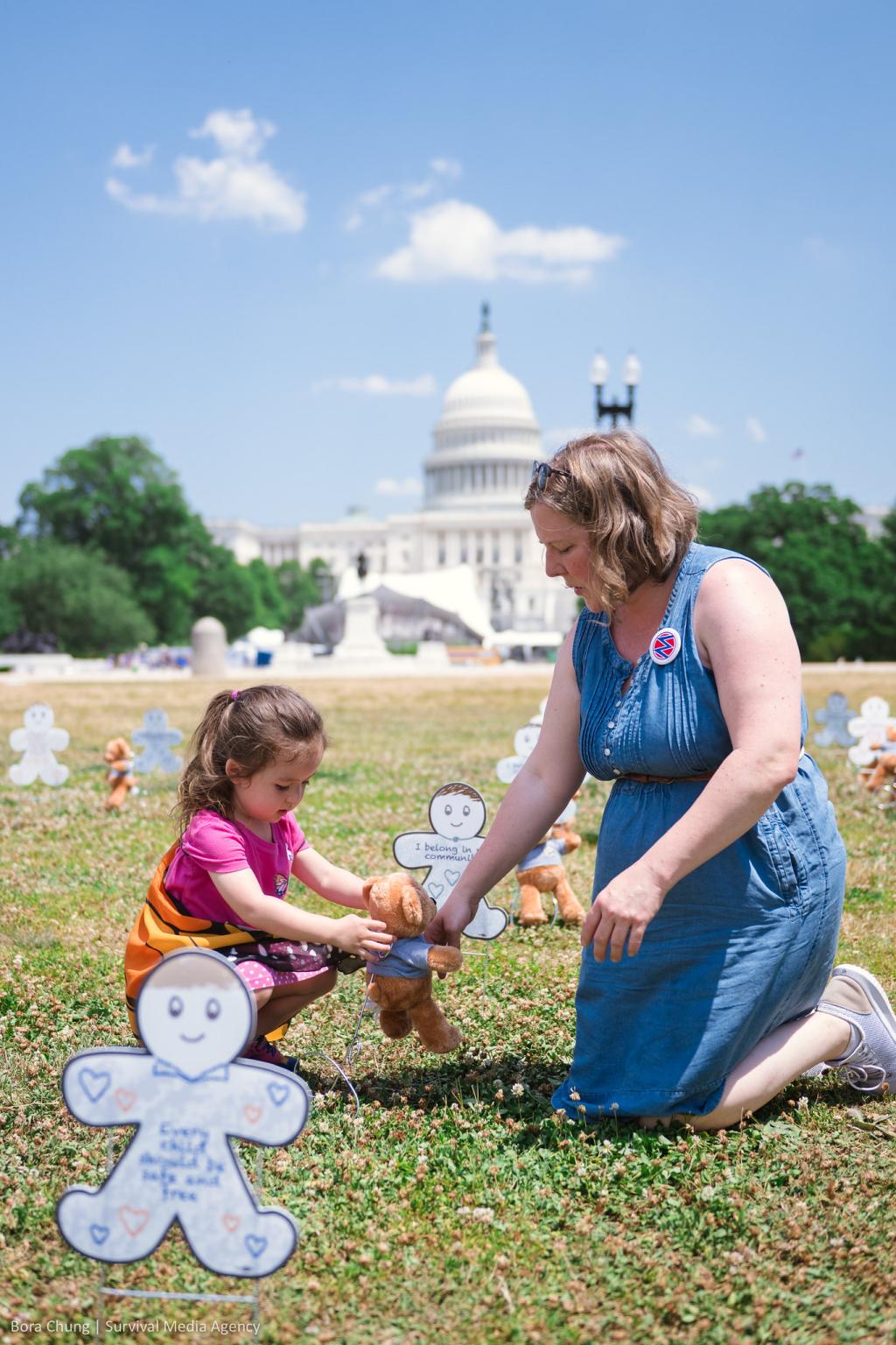 MOMbassador Jean with her daughter at the "Fund Care, Not ICE" DC event
