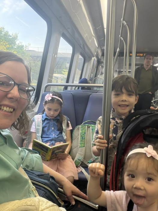 MomsRising member Jean with her three children on the way to "Moms Have the Receipts" event