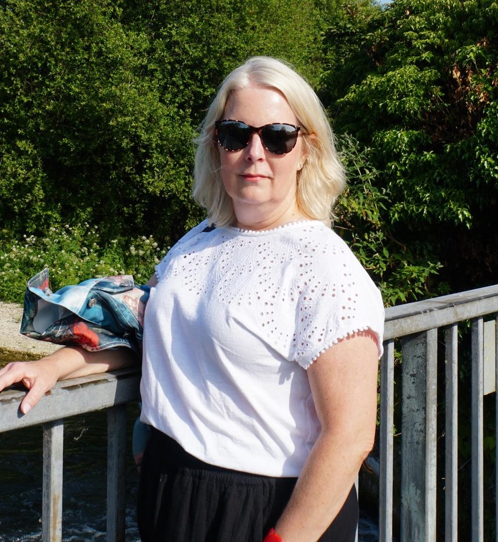 Photo of Angela, a blonde woman wearing sunglasses