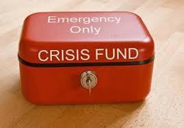 A photo of a red box that says "Emergency Only: CRISIS FUND" with a lock and key.