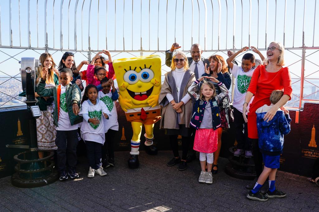 Children pose with Spongebob Squarepants at the Empire State Building for Lights On Afterschool.