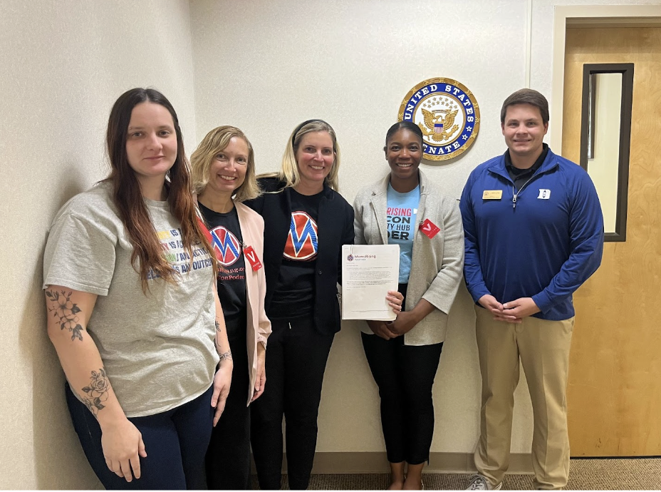 Hub Leaders sharing a gun violence prevention petition with the staff of a Member of Congress