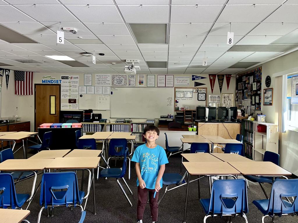 A little boy in a new classroom