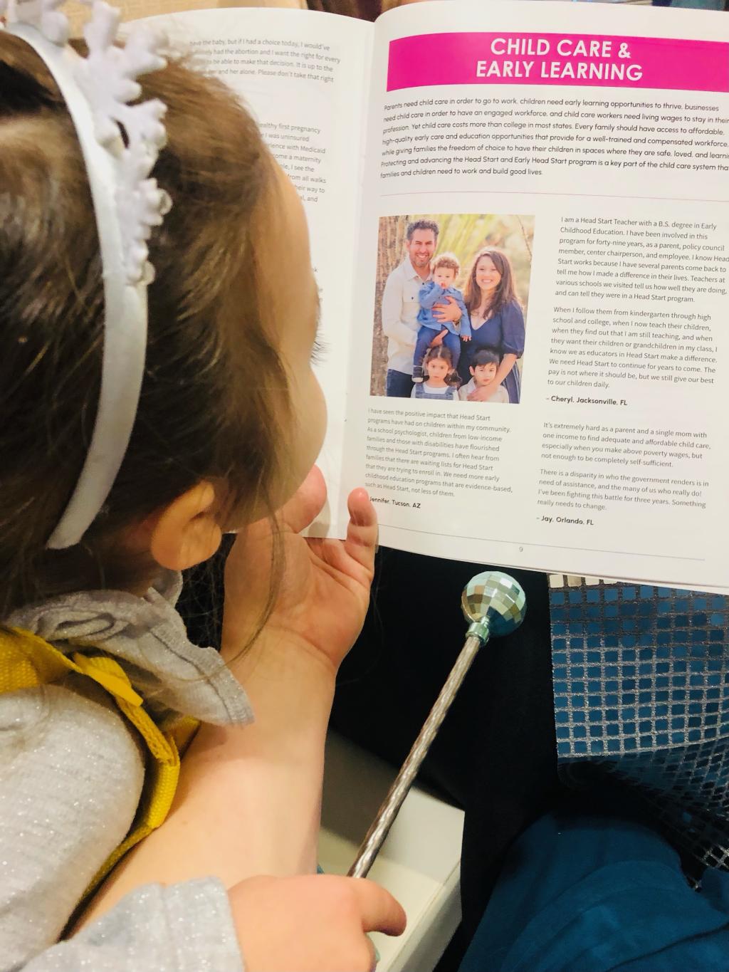 MomsRising member's child reading MomsRising disco-themed storybook