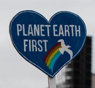 [IMAGE DESCRIPTION: A photo of a cardboard blue heart that says "Planet Earth First"]