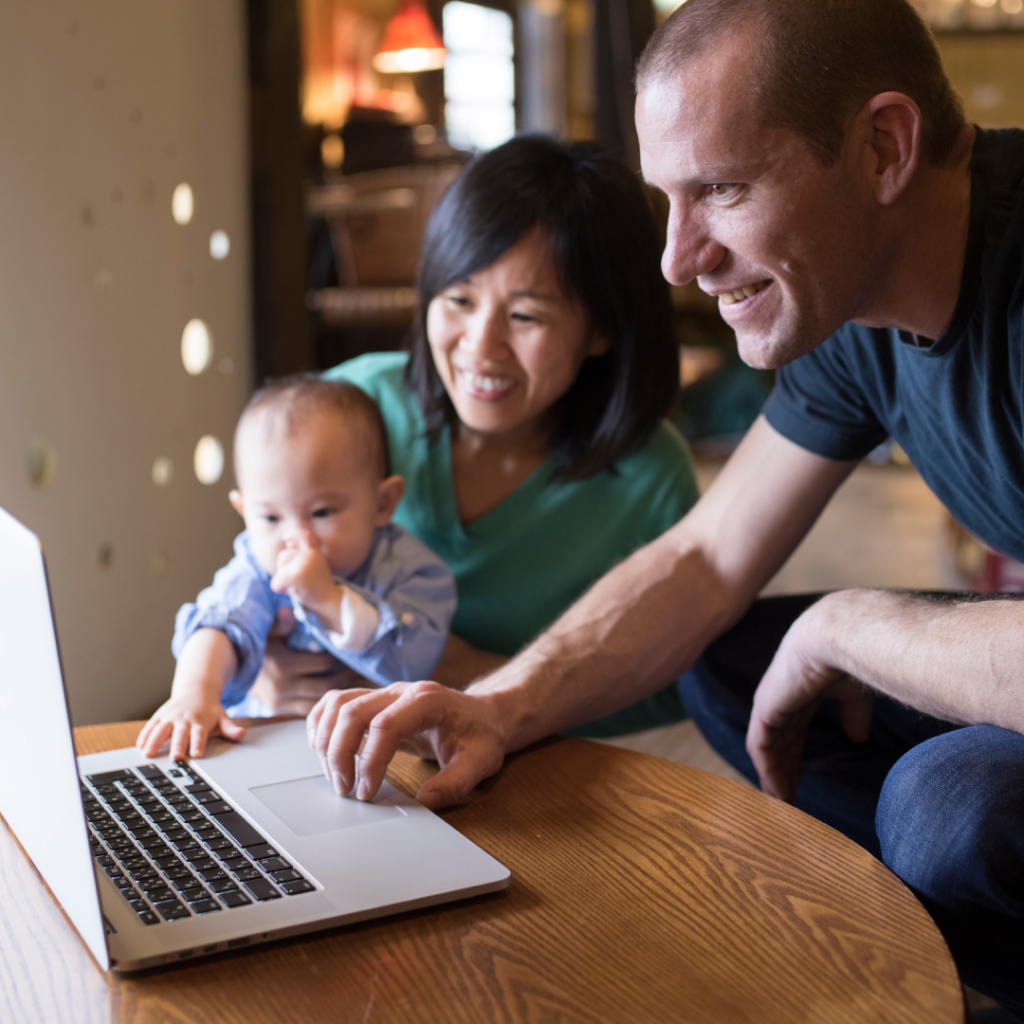 baby with parents on computer