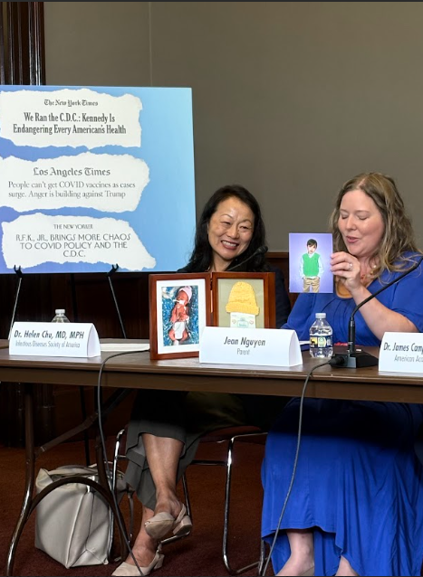 An image of Jean Nguyen, delivering vaccine panel remarks.