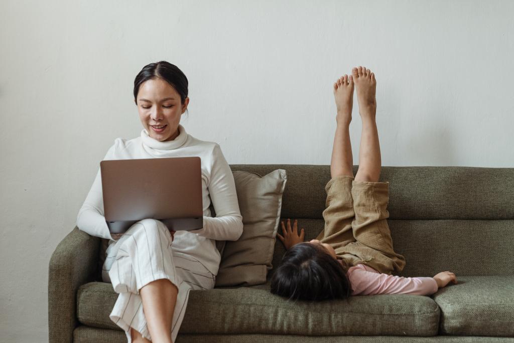 Mom on computer with daughter