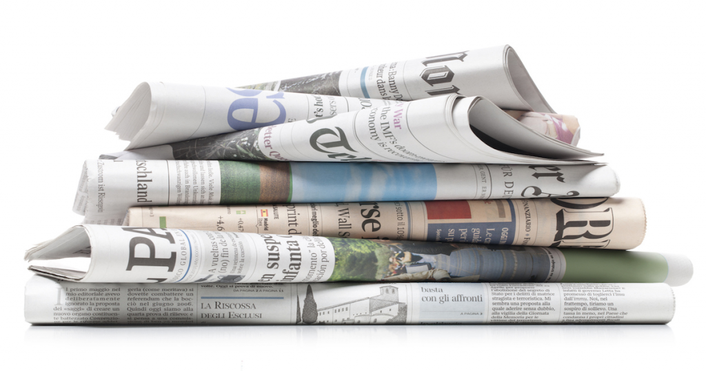 [IMAGE DESCRIPTION: A photograph of a stack of newspapers.]