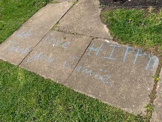 [IMAGE DESCRIPTION: A photo of a sidewalk with a thank you message written in chalk]
